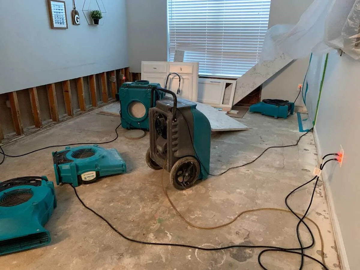 Dehumidifier in flood-cut room for Water Damage Restoration in Olive Branch